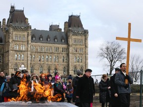 Way of the Cross through the streets of Ottawa, led by the Most Reverend Terrence Prendergast SJ, Archbishop of Ottawa stopped on Parliament Hill in Ottawa, March 30, 2018.