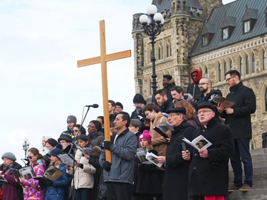 Way of the Cross through the streets of Ottawa, led by the Most Reverend Terrence Prendergast SJ, Archbishop of Ottawa stopped on Parliament Hill in Ottawa, March 30, 2018.  Photo by Jean Levac/Postmedia   128864