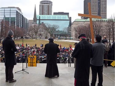Way of the Cross through the streets of Ottawa, led by the Most Reverend Terrence Prendergast SJ, Archbishop of Ottawa stopped at the Supreme Court of Canada in Ottawa, March 30, 2018.  Photo by Jean Levac/Postmedia   128864
