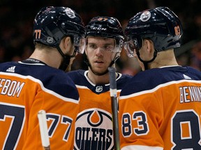 The Edmonton Oilers' Connor McDavid, centre, is in the shadow of the MVP race because the Oilers have played so poorly as a team.