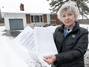 Pat Trites and her neighbours are upset that the city's committee of adjustment has approved dividing the land at 840 Balsam Dr. in Orléans to allow for two buildings, with a combined four units. Trites collected names on a petition to present to the committee, but it didn't work. Errol McGihon/Postmedia