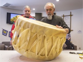 Craftsman Pinock (R) from Kitigan Zibi and Thomas Louttip construct of a traditional grandfather drum at the Mamidosewin Centre within Algonquin College. March 19,2018.