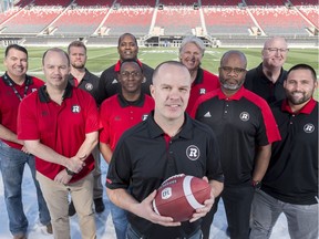 Ottawa Redblacks's Head Coach Rick Campbell with his coaching staff. Back from (l-r): Jaime Elizondo - Offensive Coordinator, Patrick Bourgon – Defensive Assistant, Leroy Blugh – Defensive line, Mark Nelson – Linebackers, John McDonell – Offensive line. Middle row: Noel Thorpe – Defensive Coordinator, Winston October – receivers, Bob Dyce – Special Teams Coordinator, Beau Walker – running backs.