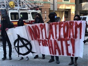 Demonstrators protest outside the Ottawa Public Library Saturday, trying to disrupt a speech by uOttawa professor Janice Fiamengo.