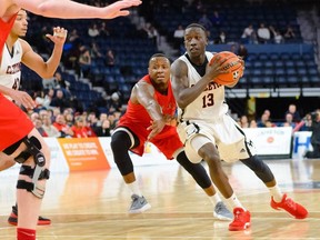 The Carleton Ravens' Munis Tutu drives around a defender against Acadia on Thursday, March 8, 2018, in Halifax.