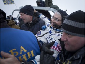 NASA astronaut Mark Vande Hei is helped out of the Soyuz MS-06 spacecraft just minutes after he, NASA astronaut Joe Acaba, and Russian cosmonaut Alexander Misurkin, landed in a remote area near the town of Zhezkazgan, Kazakhstan on Wednesday, Feb. 28, 2018 after 168 days in space onboard the International Space Station.