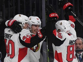 LAS VEGAS, NV - MARCH 02:  Jim O'Brien #40, Alexandre Burrows #14 and Max McCormick #89 of the Ottawa Senators celebrate after Burrows scored a third-period goal against the Vegas Golden Knights during their game at T-Mobile Arena on March 2, 2018 in Las Vegas, Nevada. The Senators won 5-4.