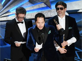 Production designers Jeff Melvin, Paul Denham Austerberry and Shane Vieau accept Best Production Design for 'The Shape of Water' onstage during the 90th Annual Academy Awards.