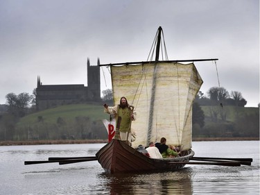 Marty Burns who plays Saint Patrick is brought to shore past Downpatrick cathedral as the re-enactment of Saint Patrick's first landing in Ireland takes place at Inch Abbey on March 11, 2018 in Downpatrick, Northern Ireland. The Irish annals for the fifth century date Patrick's arrival in Ireland in the year 432. The patron saint of Ireland's remains are believed to be buried at Down Cathedral. Saint Patrick's Day is celebrated on the 17th of March.