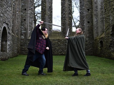 Game of Thrones fans on the Game of Thrones tour mock fight inside Inch Abbey as the re-enactment of Saint Patrick's first landing in Ireland takes place at Inch Abbey on March 11, 2018 in Downpatrick, Northern Ireland. The Irish annals for the fifth century date Patrick's arrival in Ireland in the year 432. The patron saint of Ireland's remains are believed to be buried nearby at Down Cathedral. Saint Patrick's Day is celebrated on the 17th of March. Inch Abbey ruins were used for Game of Thrones filming.