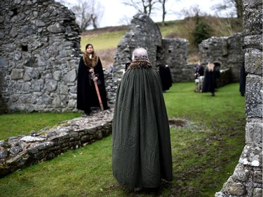 Game of Thrones fans on the Game of Thrones tour pose inside Inch Abbey as the re-enactment of Saint Patrick's first landing in Ireland takes place at Inch Abbey on March 11, 2018 in Downpatrick, Northern Ireland. The Irish annals for the fifth century date Patrick's arrival in Ireland in the year 432. The patron saint of Ireland's remains are believed to be buried nearby at Down Cathedral. Saint Patrick's Day is celebrated on the 17th of March.