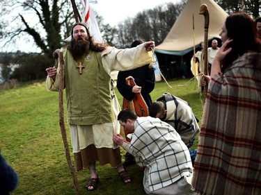 Marty Burns who plays Saint Patrick frees 'slaves' as the re-enactment of Saint Patrick's first landing in Ireland takes place at Inch Abbey on March 11, 2018 in Downpatrick, Northern Ireland. The Irish annals for the fifth century date Patrick's arrival in Ireland in the year 432. The patron saint of Ireland's remains are believed to be buried at Down Cathedral. Saint Patrick's Day is celebrated on the 17th of March.
