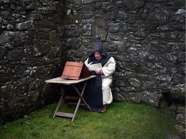 A member of the Magnus Viking association writes scripture as he takes part in the re-enactment of Saint Patrick's first landing in Ireland at Inch Abbey on March 11, 2018 in Downpatrick, Northern Ireland. The Irish annals for the fifth century date Patrick's arrival in Ireland in the year 432. The patron saint of Ireland's remains are believed to be buried nearby at Down Cathedral. Saint Patrick's Day is celebrated on the 17th of March.