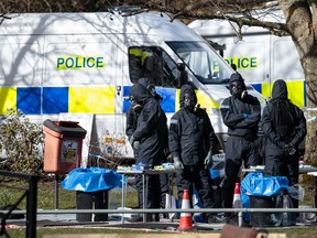 SALISBURY, ENGLAND, MARCH 16: Police officers in protective suits and masks work near the scene where former double-agent Sergei Skripal and his daughter, Yulia were discovered after being attacked with a nerve-agent on March 16, 2018 in Salisbury, England. Britain has expelled 23 Russian diplomats over the nerve agent attack.