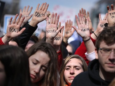 WASHINGTON, DC - MARCH 24:  Protesters gather for the March for Our Lives rally along Pennsylvania Avenue March 24, 2018 in Washington, DC. Hundreds of thousands of demonstrators, including students, teachers and parents gathered in Washington for the anti-gun violence rally organized by survivors of the Marjory Stoneman Douglas High School school shooting on February 14 that left 17 dead. More than 800 related events are taking place around the world to call for legislative action to address school safety and gun violence.