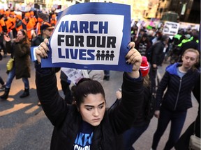 Thousands of people, many of them students, march against gun violence in Manhattan during the March for Our Lives rally on March 24, 2018 in New York City. More than 800 March for Our Lives events, organized by survivors of the Parkland, Florida school shooting on February 14 that left 17 dead, are taking place around the world to call for legislative action to address school safety and gun violence.