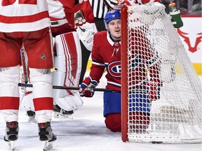 Brendan Gallagher #11 of the Montreal Canadiens falls inside the net against the Detroit Red Wings.