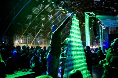 Michael Erdmann places one of the last cups on the tower of cups he built with Brendan Doan (right).