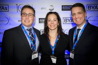 From left, Michael Roberts, Erin Prime and Mark Belanger were at the event to show support for the finalists.