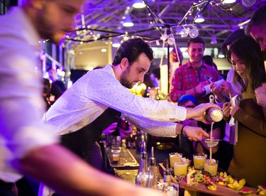 Connor Currie of Charlotte works on preparing his cocktail for the judges.