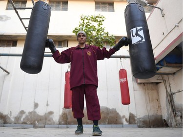 To mark the occasion of International Women's Day on March 8, 2018 AFP presents a series of 45 photos depicting women performing roles or working in professions more traditionally held by men.  More images can be found in www.afpforum.com  Search SLUG  "WOMEN-DAY -PACKAGE".  Razia Banu, 20, a Pakistani female national boxing champion, poses for a picture before a practice session at a boxing club in Lyari, Karachi's most restive -- and sporty -- neighbourhood, on February 20, 2018. In the ring, battling flames or lifting off into space, women have entered professions generally considered as men's jobs. For International Women's Day, AFP met with women breaking down the barriers of gender-bias in the work world.