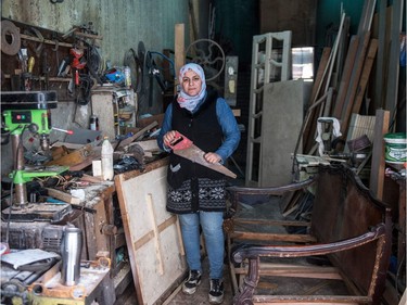 To mark the occasion of International Women's Day on March 8, 2018 AFP presents a series of 45 photos depicting women performing roles or working in professions more traditionally held by men.  More images can be found in www.afpforum.com  Search SLUG  "WOMEN-DAY -PACKAGE".  Asmaa Megahed a 31-year-old Egyptian carpenter poses for a picture at her workshop in Abdeen district in downtown Cairo on February 26, 2018. In the ring, battling flames or lifting off into space, women have entered professions generally considered as men's jobs. For International Women's Day, AFP met with women breaking down the barriers of gender-bias in the work world.