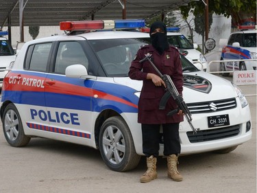 To mark the occasion of International Women's Day on March 8, 2018 AFP presents a series of 45 photos depicting women performing roles or working in professions more traditionally held by men.  More images can be found in www.afpforum.com  Search SLUG  "WOMEN-DAY -PACKAGE".  Zahida, a Pakistani female police Assistance Sub-Inspector (ASI), poses for a photograph at a police academy in Peshawar on February 26, 2018. In the ring, battling flames or lifting off into space, women have entered professions generally considered as men's jobs. For International Women's Day, AFP met with women breaking down the barriers of gender-bias in the work world.