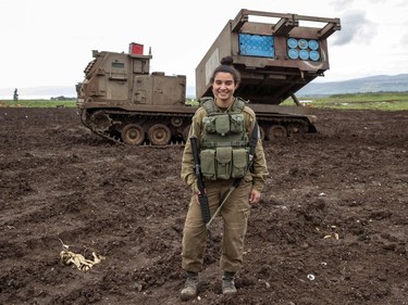 To mark the occasion of International Women's Day on March 8, 2018 AFP presents a series of 45 photos depicting women performing roles or working in professions more traditionally held by men.  More images can be found in www.afpforum.com  Search SLUG  "WOMEN-DAY -PACKAGE".  Israeli army sergeant Amit Malekin, 19, commander of a mobile rocket launcher, poses for a picture in the Israeli-annexed Golan Heights near the border between Israel and Syria on February 26, 2018. In the ring, battling flames or lifting off into space, women have entered professions generally considered as men's jobs. For International Women's Day, AFP met with women breaking down the barriers of gender-bias in the work world.