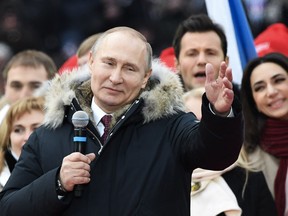Presidential candidate, President Vladimir Putin attends a rally to support his candidature in the upcoming presidential election at the Luzhniki stadium in Moscow on March 3, 2018. Russians will go to the polls on March 18, 2018.