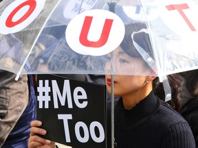 A South Korean demonstrator holds a banner during a rally to mark International Women's Day as part of the country's #MeToo movement.