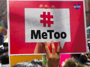 A South Korean demonstrator holds a banner during a rally to mark International Women's Day as part of the country's #MeToo movement in Seoul on March 8, 2018.