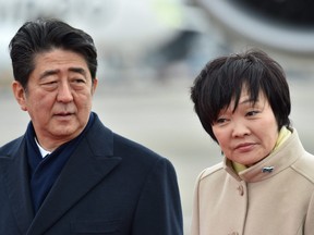 This file picture taken on February 28, 2017 shows Japan's Prime Minister Shinzo Abe and his wife Akie Abe at Tokyo's Haneda Airport.