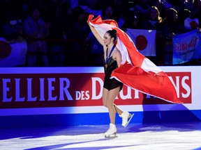 Kaetlyn Osmond from Canada celebrates after winning the women's world figure skating championship oin Friday.