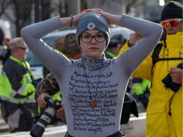 A woman wears a protest shirt as people arrive early for the March For Our Lives rally against gun violence in Washington, DC on March 24, 2018.