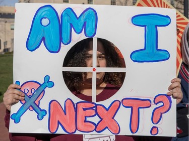 A student from Baltimore, Maryland, holds a protest sign during the March for Our Lives Rally in Washington, DC on March 24, 2018.  Galvanized by a massacre at a Florida high school, hundreds of thousands of Americans are expected to take to the streets in cities across the United States on Saturday in the biggest protest for gun control in a generation.