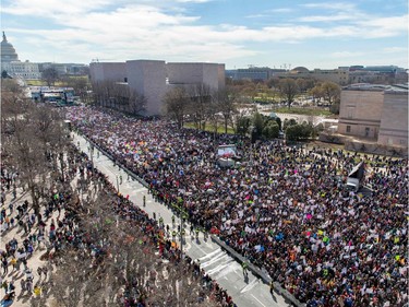 The crowd at the March for Our Lives Rally as seen from the roof of the Newseum in Washington, DC on March 24, 2018.  Galvanized by a massacre at a Florida high school, hundreds of thousands of Americans are expected to take to the streets in cities across the United States on Saturday in the biggest protest for gun control in a generation.