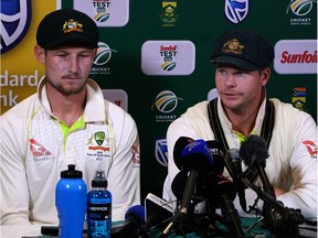 This video grab taken from a footage released by AFP TV shows Australia's captain Steve Smith (R), flankled by teammate Cameron Bancroft, speaking during a press conference in Cape Town, on March 24, 2018 as he admitted to ball-tampering during the third Test against South Africa. Australia captain Steve Smith and team-mate Cameron Bancroft sensationally admitted to ball-tampering during the third Test against South Africa on March 24, 2018, plunging cricket into potentially its greatest crisis. Bancroft was caught on television cameras appearing to rub a yellow object on the ball, and later said: "I was in the wrong place at the wrong time. I want to be here (in the press conference) because I want to be accountable for my actions."