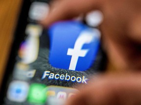 An illustration picture taken through a magnifying glass on March 28, 2018 in Moscow shows the icon for the social networking app Facebook on a smart phone screen. Facebook said on March 28, 2018 it would overhaul its privacy settings tools to put users "more in control" of their information on the social media website. The updates include improving ease of access to Facebook's user settings, a privacy shortcuts menu and tools to search for, download and delete personal data stored by Facebook. / AFP PHOTO / Mladen ANTONOVMLADEN ANTONOV/AFP/Getty Images