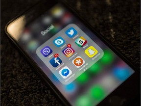 Social Network applications including Facebook, Instagram, Slack, Snapchat, Twitter, Skype, Viber , Teamsnap and Messenger, are on display on a smartphone.