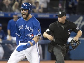Blue Jays outfielder Kevin Pillar reacts after stealing home in the eighth inning of Saturday's game against the Yankees.