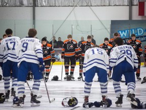 The Don Mills Flyers Bantam AAA team (back) took to the ice for the first time since their goalie Roy Pejcinovski was killed in a triple homicide to play a friendly scrimmage against the Toronto Marlboros in Toronto on Sunday, March 18, 2018.