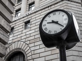 A clock on a city block in Montreal, Que.