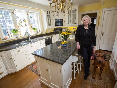 This at-home feature with architect Sarah Murray, seen here in her kitchen, and her 100-year-old cottage in Rockliffe.  Her two dogs are Rhodesian Ridgebacks named Roo and Guinness. 
0317 home architect