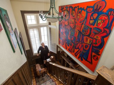 A look at the stairwell with family and acclaimed artist paintings. At home with architect Sarah Murray and her 100-year-old cottage in Rockcliffe.
