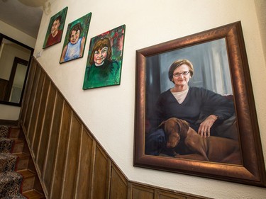 A look at the stairwell with family paintings.At home with architect Sarah Murray and her 100-year-old cottage in Rockcliffe.