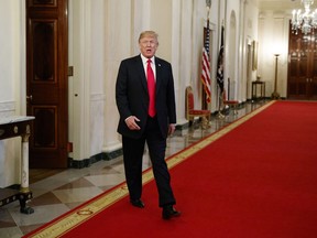 President Donald Trump arrives to speak to the White House Opioid Summit in the East Room of the White House, Thursday, March 1, 2018, in Washington.