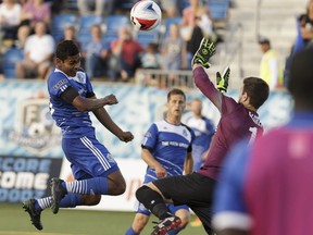 Shamit Shome (26) heads the ball during an FC Edmonton match against the New York Cosmos in July 2016. Ian Kucerak/Postmedia