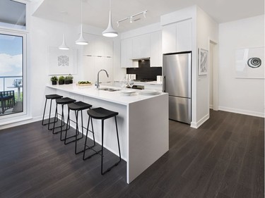 Featuring mostly standard finishes, eQ's condo model boasts a handy pantry wall right in the kitchen and contemporary, clean-lined finishes.