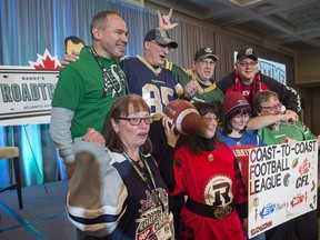 Fans show their support for a local team as they wait for Randy Ambrosie, the Canadian Football League's commissioner, at a public town hall meeting in Halifax on Friday, Feb. 23, 2018. The league has been in talks with a group of prospective owners interested in a Halifax franchise.
