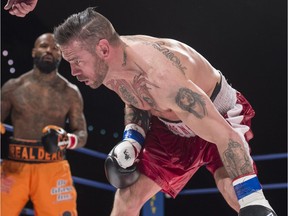 David Whittom, front, is seen here during a 2016 fight against Ryan Ford in Edmonton. Whittom died this weekend, 10 months after his last bout in Fredericton.  Shaughn Butts/POSTMEDIA